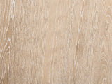 Close-up of the Chiavari Oak Veneer Round Pedestal Coffee Table: the limed oak veneer grain of the top