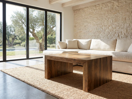 Chieri 34-Inch Square Solid Sheesham Waterfall Coffee Table on a jute rug in front of a linen sofa in a poolside villa