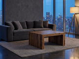 Chieri 34-Inch Square Solid Sheesham Waterfall Coffee Table on a wool rug in front of a velvet sofa in a city penthouse at blue hour