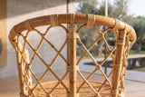 Close-up of the Cicala Natural Rattan Lattice-Back Bar Stool: lattice