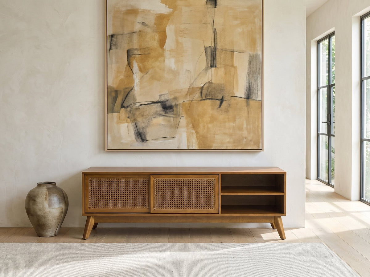 Cisternino 59-Inch Pecan Birch Veneer and Cane Media Console under a large abstract painting in a bright living room