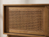 Close-up of the Cisternino 59-Inch Pecan Birch Veneer and Cane Media Console: a sliding door's natural woven cane panel in its mitred wooden frame