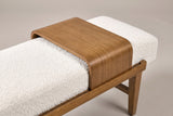 The Citerna tray from above: one piece of wood curving down over the front and back of the ivory cushion to rest on the rail, with a leg and stretcher below