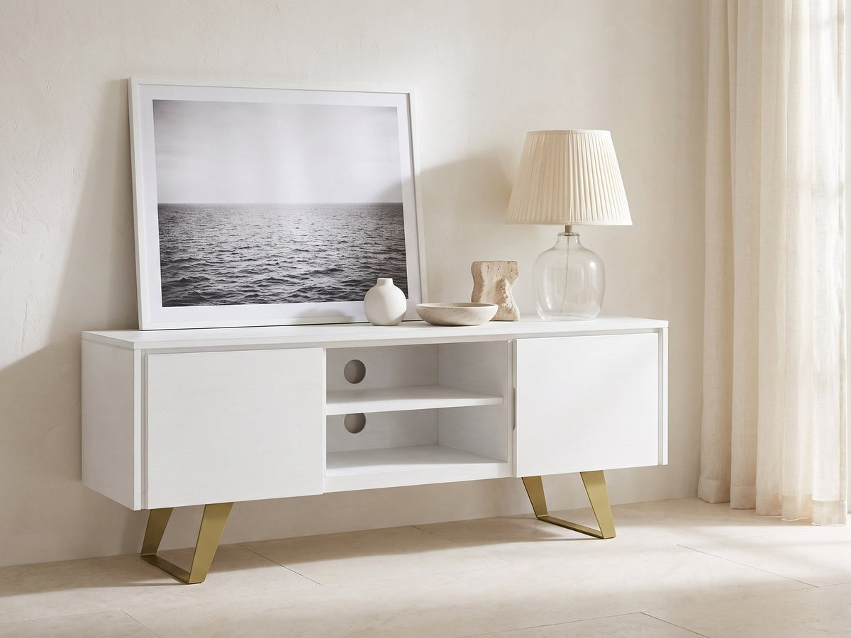 Cittadella White Media Console styled with a leaning print, a lamp and ceramics in a bright plaster room