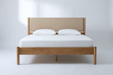 Civitella bed in light walnut with a beige headboard, a white mattress and pillows (not included), front view