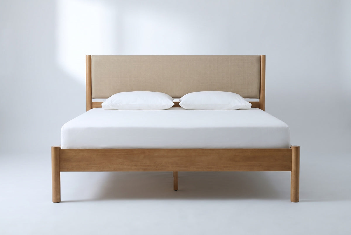 Civitella bed in light walnut with a beige headboard, a white mattress and pillows (not included), front view