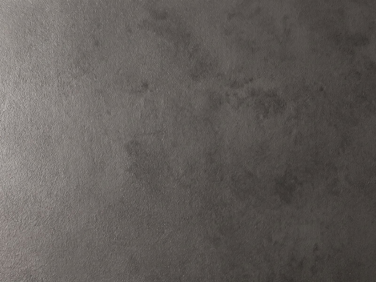 Close-up of the Colledara Cast Aluminum Bowl Side Table: the hand-finished graphite texture of the cast aluminum