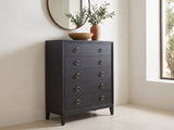 Cologna 40-Inch Peppercorn 5-Drawer Chest under a round bronze mirror in a villa bedroom