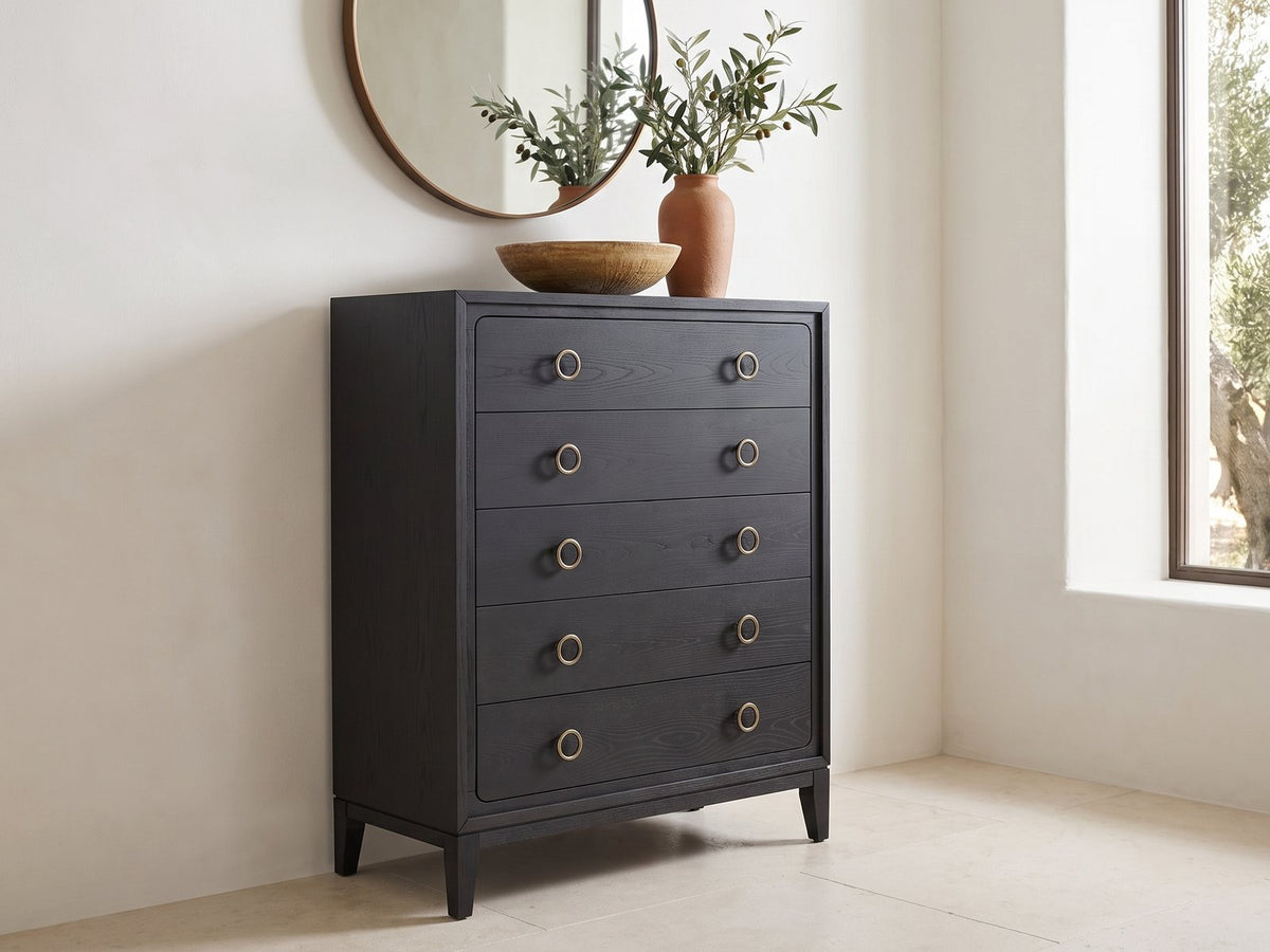 Cologna 40-Inch Peppercorn 5-Drawer Chest under a round bronze mirror in a villa bedroom
