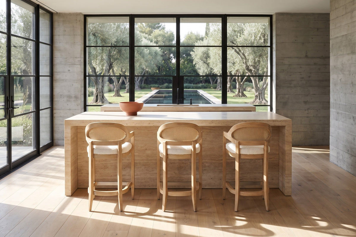 Conflenti 26-Inch Cane-Back Oak Counter Stool, Ivory Boucle in a sunlit villa dining room