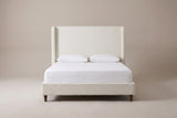 Conversano bed in cream white boucle with a white mattress and pillows (not included), front view