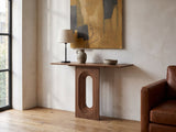 Corato Walnut Veneer Pedestal Console Table against a plaster wall in an industrial loft