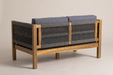The Corleone loveseat from behind: two rope-woven back panels around a central acacia post, a woven arm and square legs
