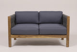 The Corleone loveseat from the front: square acacia posts, rope-woven arms, two seat and two back cushions in dark grey