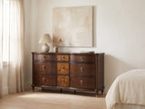 Cormons 66-Inch Dark Cherry and Burl 9-Drawer Dresser against a plaster wall under an abstract canvas in a bright bedroom
