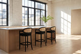 Cortale 30.5-Inch Cane-Back Black Oak Bar Stool in a city loft
