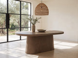 Cotronei 84-Inch Oval Cocoa Wood Veneer Pedestal Dining Table in a sunlit villa dining area with olive trees outside