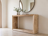 Crispiano Mango Wood Open Frame Console Table under a round mirror in a travertine entryway