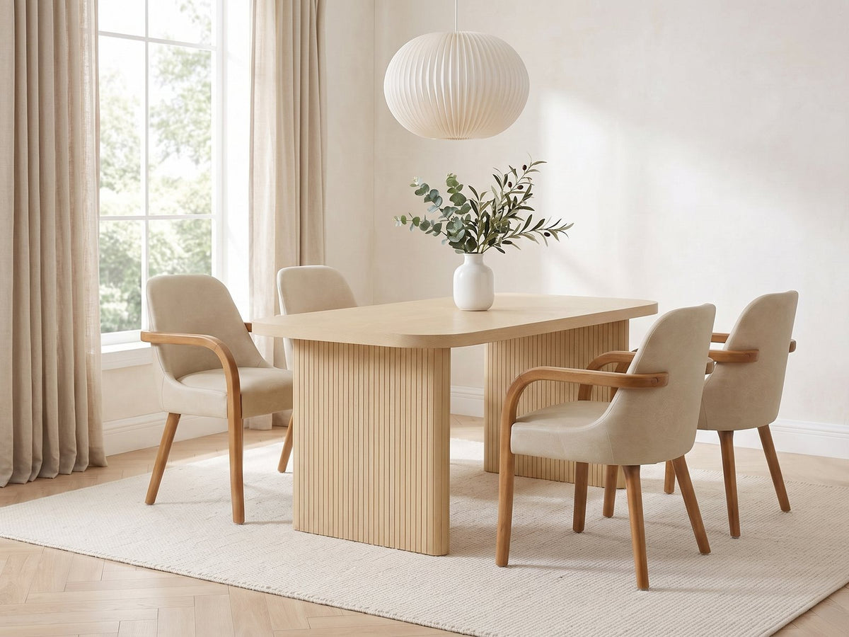 Cropani 69-Inch Rectangular Fluted Dining Set with 4 Arm Chairs in a bright plaster dining room with linen curtains