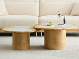 Cuneo 29-Inch Pebble Burl Veneer and Sintered Stone Coffee Table Set in front of a cream boucle sofa, the smaller table tucked under the edge of the larger one