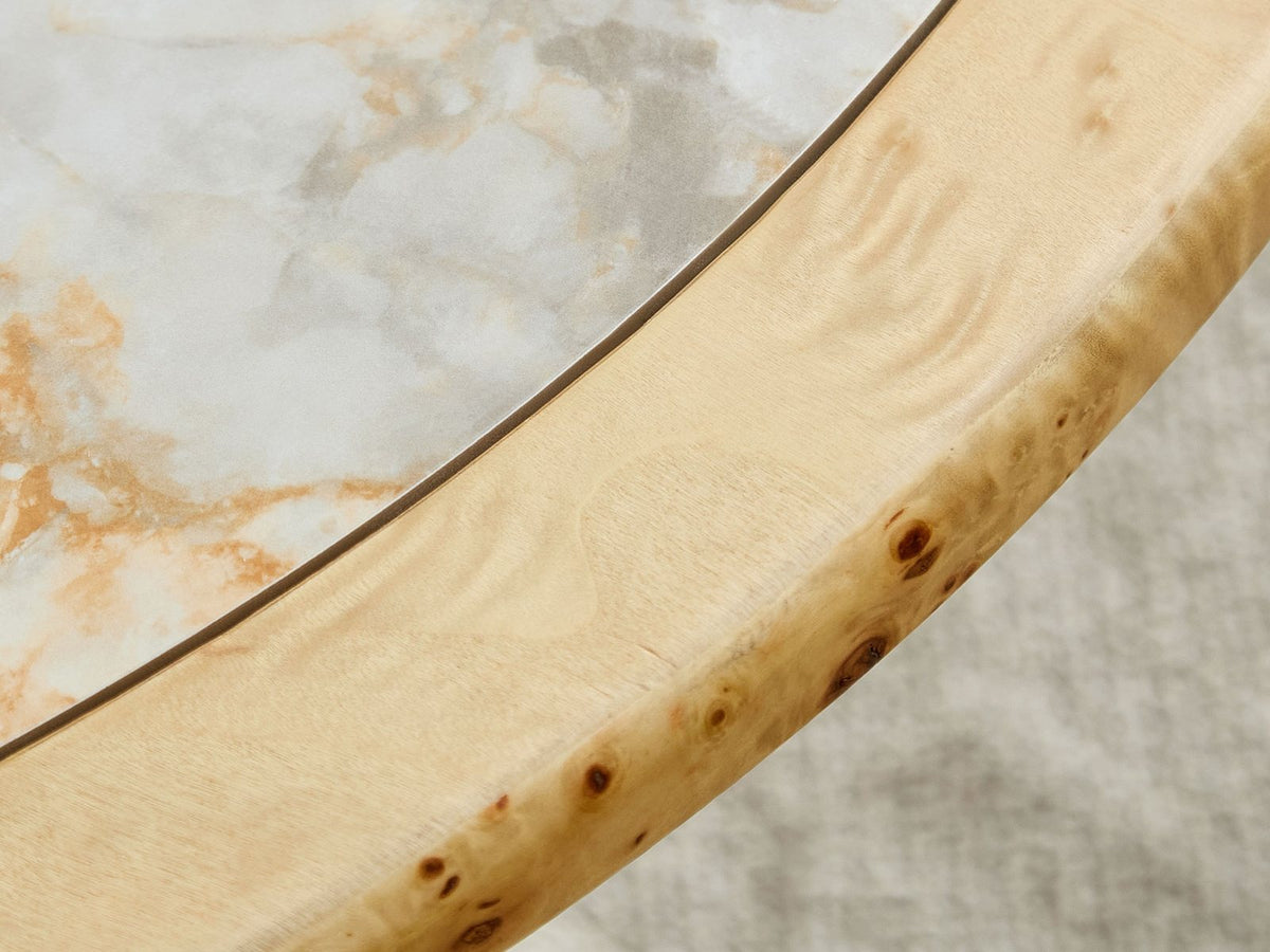 Close-up of the Cuneo 29-Inch Pebble Burl Veneer and Sintered Stone Coffee Table Set: the rounded burl veneer rim around the white sintered stone inset