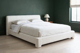Cupello platform bed against a deep forest green plaster wall in a Portland bedroom with white oak floors and a walnut side table