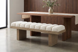 Deruta bench pulled up to a long walnut dining table in a Los Angeles dining room with fluted walnut wall panels and a pale polished concrete floor (table not included)