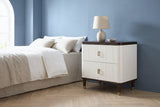 Desulo white fluted nightstand with a walnut-tone top and a ceramic lamp beside a bed in a Dallas bedroom with a dusty blue wall and an arched window