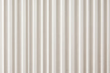 Close-up of the fine vertical flutes on a white drawer front of the Desulo nightstand