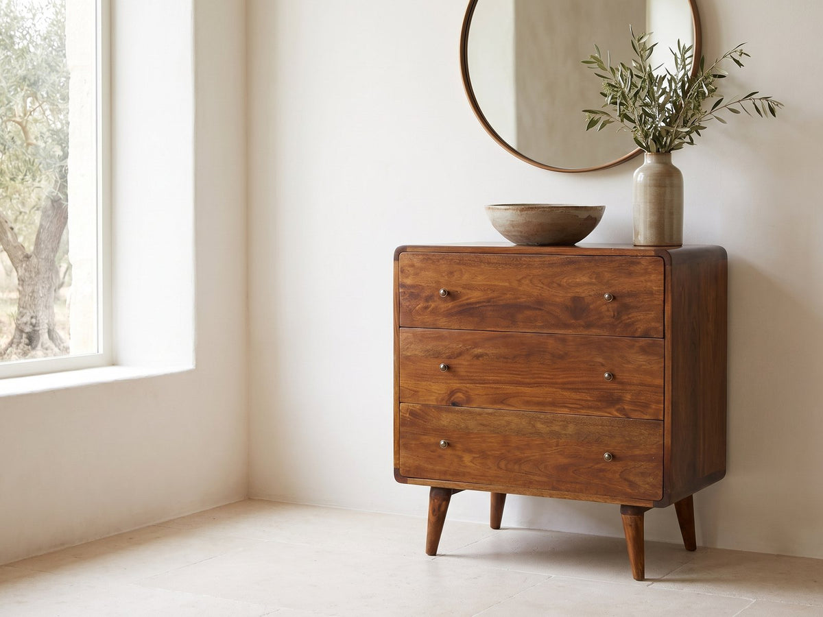 Dolo 28-Inch Chestnut Solid Mango 3-Drawer Chest under a round bronze mirror in a villa bedroom
