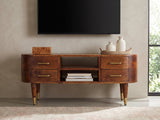 Erice Curved Mango Media Console styled with a box, a tray of vases and books under a wall-mounted screen
