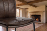 Close-up of the Falerna 30-Inch Top-Grain Leather Bar Stool with Hammered Iron Legs: leather