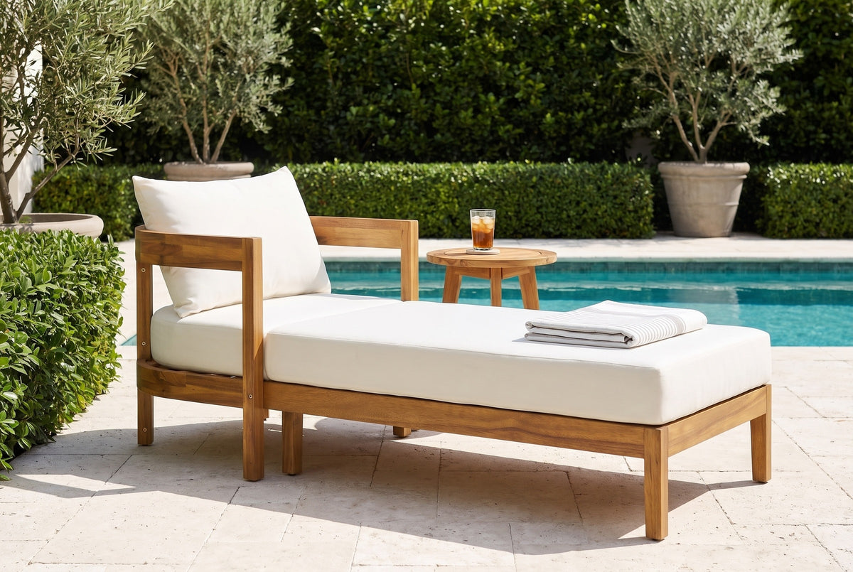 Favignana acacia chaise lounge on a limestone pool terrace at a Palm Beach villa, a clipped hedge and potted olive trees behind (side table not included)