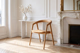 Filadelfia Sculpted Oak Wood Dining Arm Chair in a Paris salon