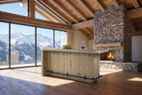 Firmo 78-Inch 2-Drawer Knotty Oak Veneer Counter-Height Home Bar with Footrest in an alpine chalet