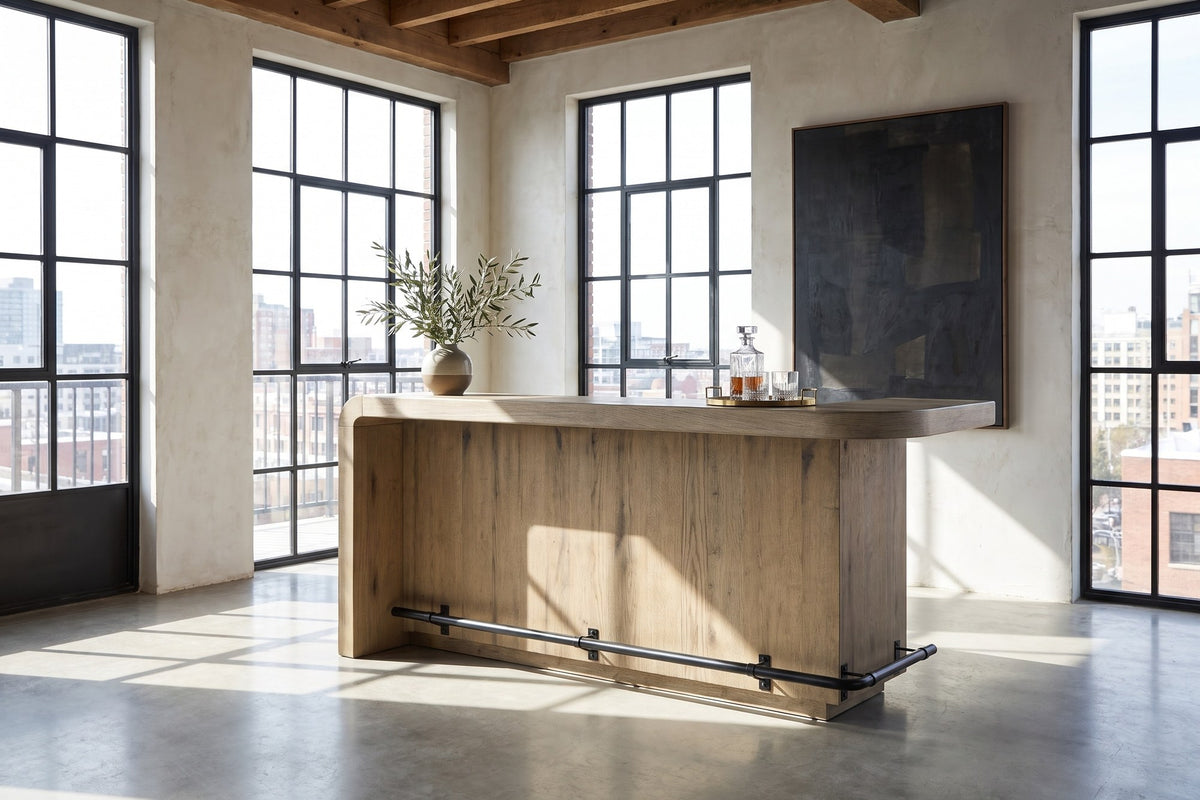 Firmo 78-Inch 2-Drawer Knotty Oak Veneer Counter-Height Home Bar with Footrest in a city loft