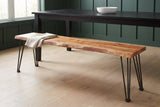 Foligno live-edge acacia bench pulled up to a dark dining table in a Hudson Valley dining room with deep green board-and-batten walls and a pale oak floor (table not included)