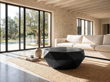 Follonica Faceted Acacia Coffee Table on a jute rug in front of a linen sofa in a poolside villa