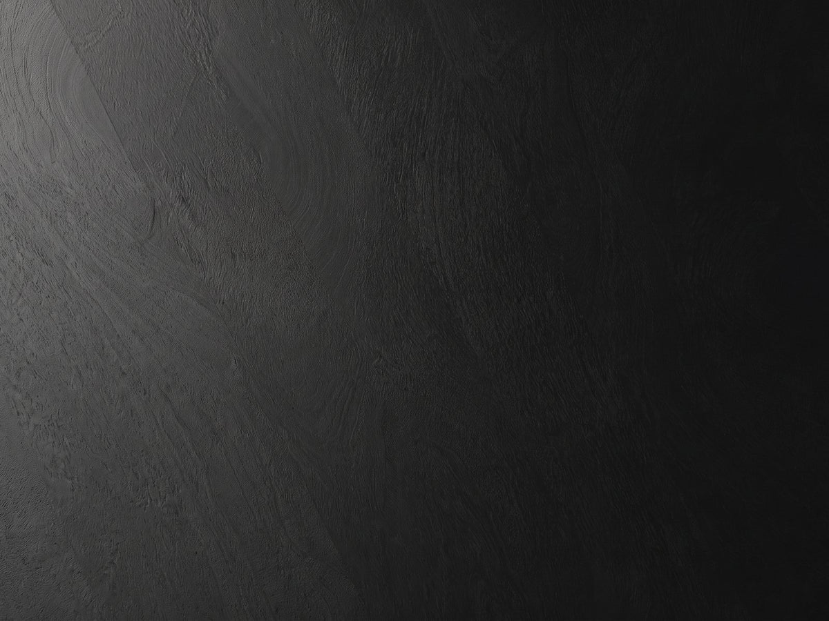 Close-up of the Follonica Faceted Acacia Coffee Table: the black-stained acacia grain of the top