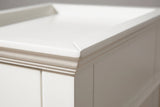 Close-up of the raised lip and the stepped cove moulding at the corner of the white tray top of the Fonni nightstand