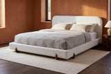 Fossacesia bed against a terracotta clay plaster wall in a Santa Fe adobe bedroom with a dark timber floor
