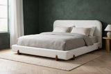 Fossacesia bed against a deep forest green limewash wall in a Seattle townhouse bedroom with a pale oak herringbone floor