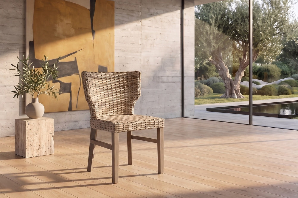 Frascineto Wingback Grey Rattan Dining Chair in a sunlit villa dining room