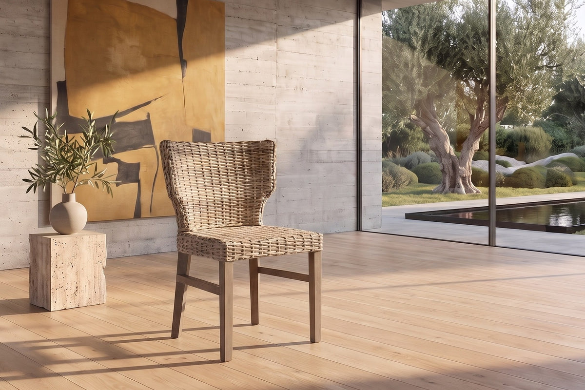 Frascineto Wingback Grey Rattan Dining Chair in a sunlit villa dining room