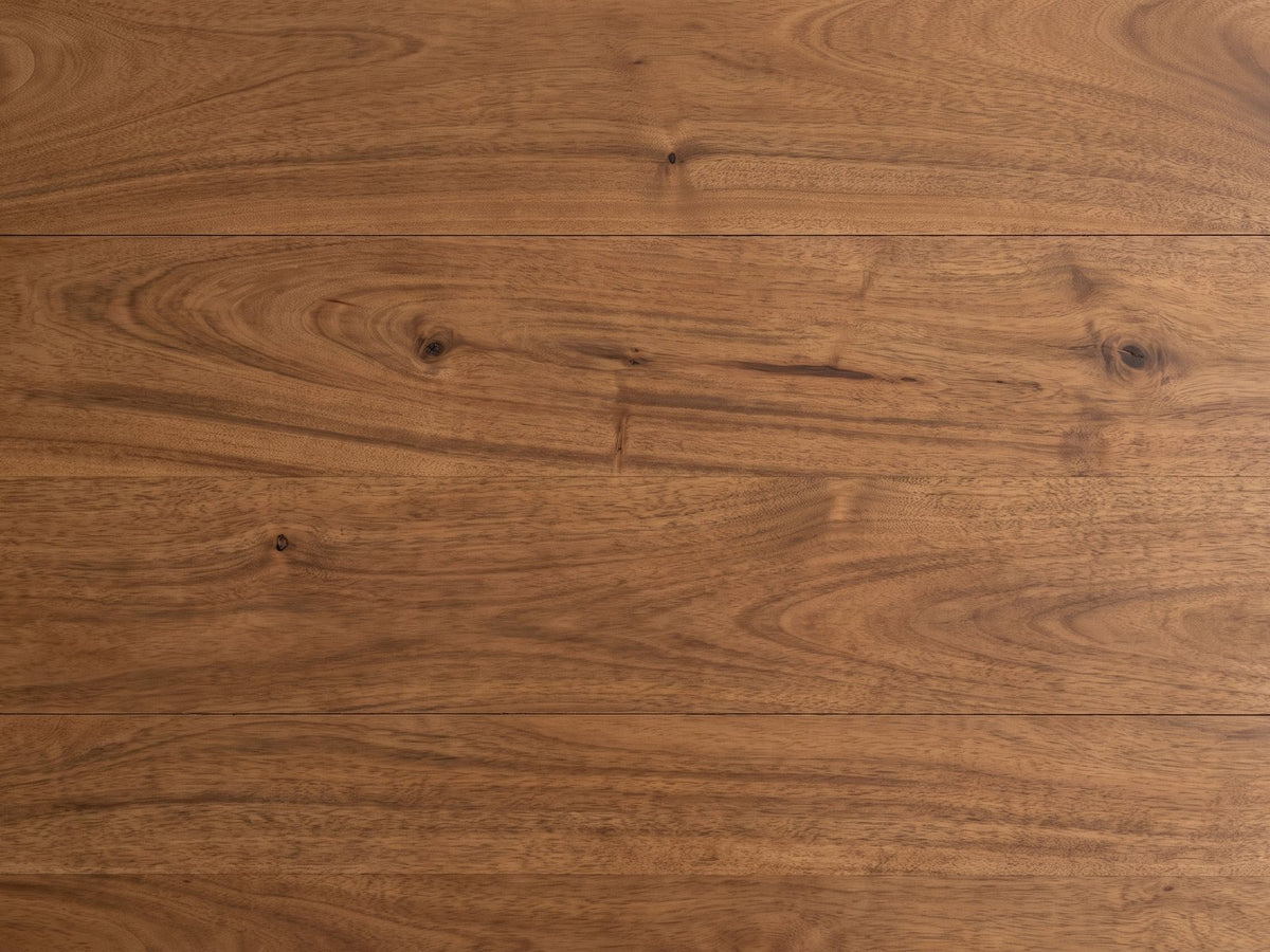 Close-up of the Fuscaldo 47-Inch Round Mango Wood Slatted Pedestal Dining Table: the plank grain and small knots of the solid mango top