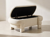 Gaeta Oval Storage Bench in ivory against a plaster wall in morning light