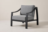 The Galati black aluminum lounge chair with dark gray cushions, three-quarter front view on a light studio backdrop