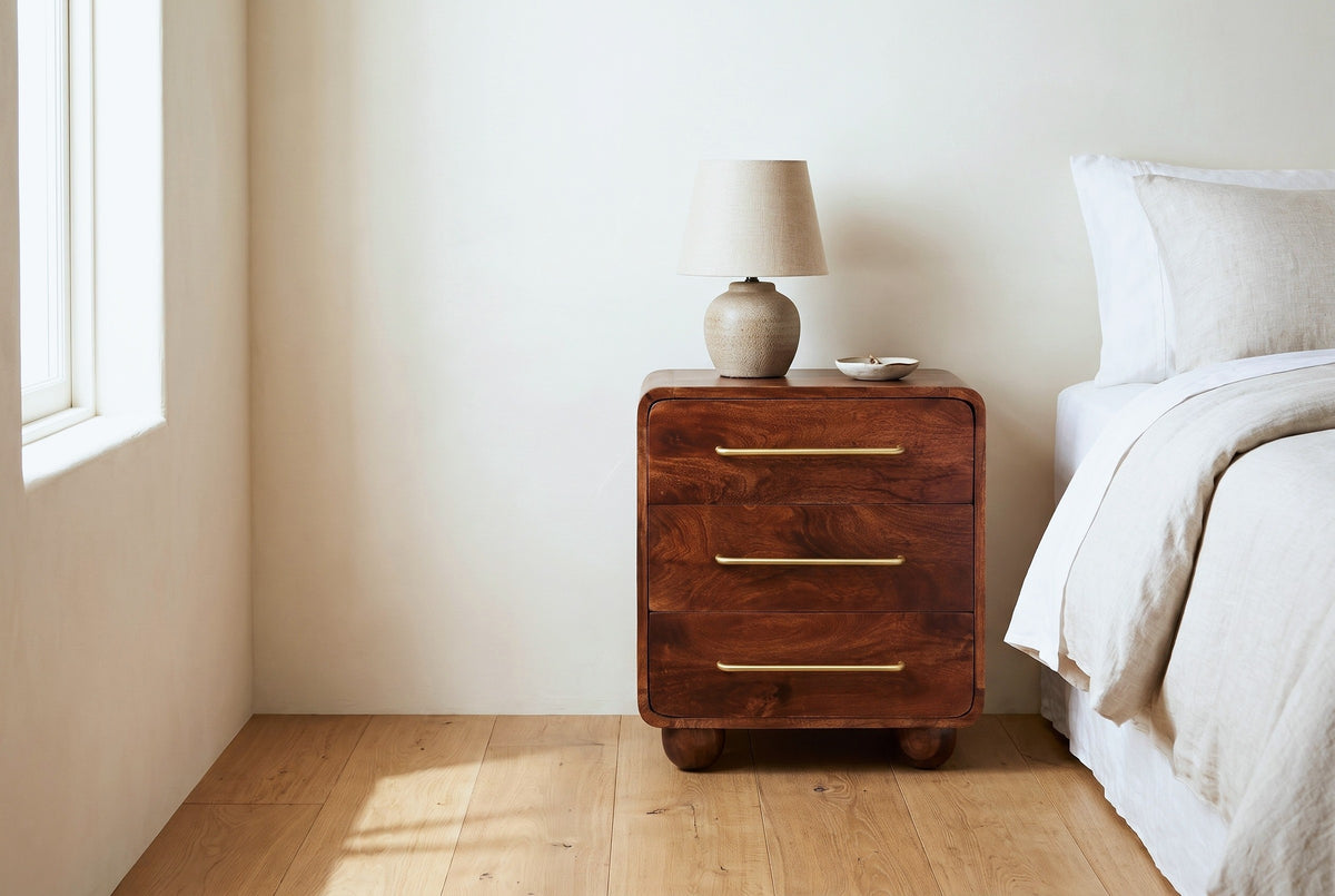 Galtelli chestnut mango nightstand against a warm ivory plaster wall in a Napa Valley bedroom with honey oak floors