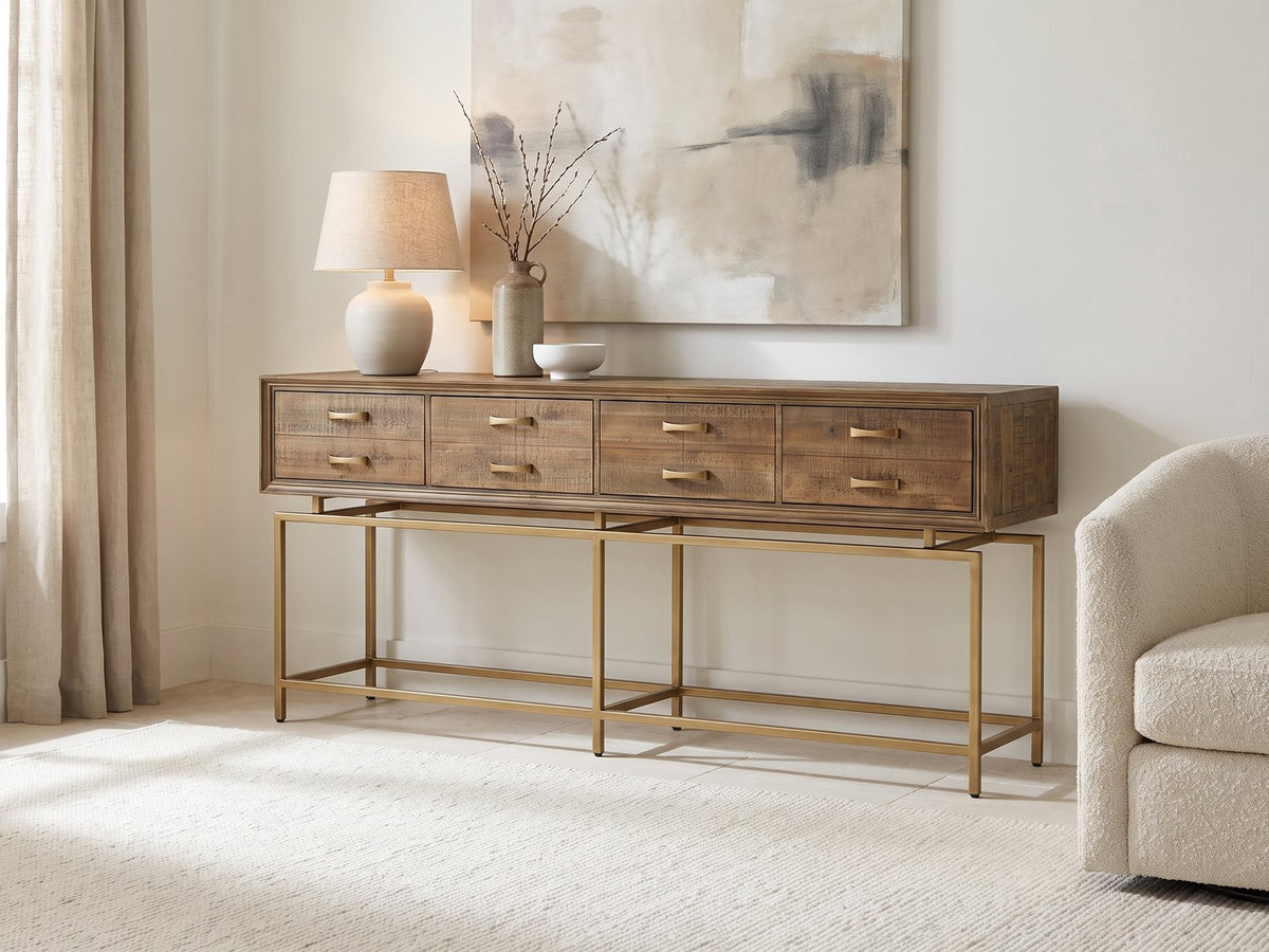 Gasperina Reclaimed Fir Four-Drawer Console Table against a plaster wall under an abstract canvas in a bright living room