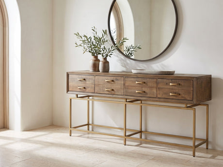 Gasperina Reclaimed Fir Four-Drawer Console Table under a round mirror in a travertine entryway